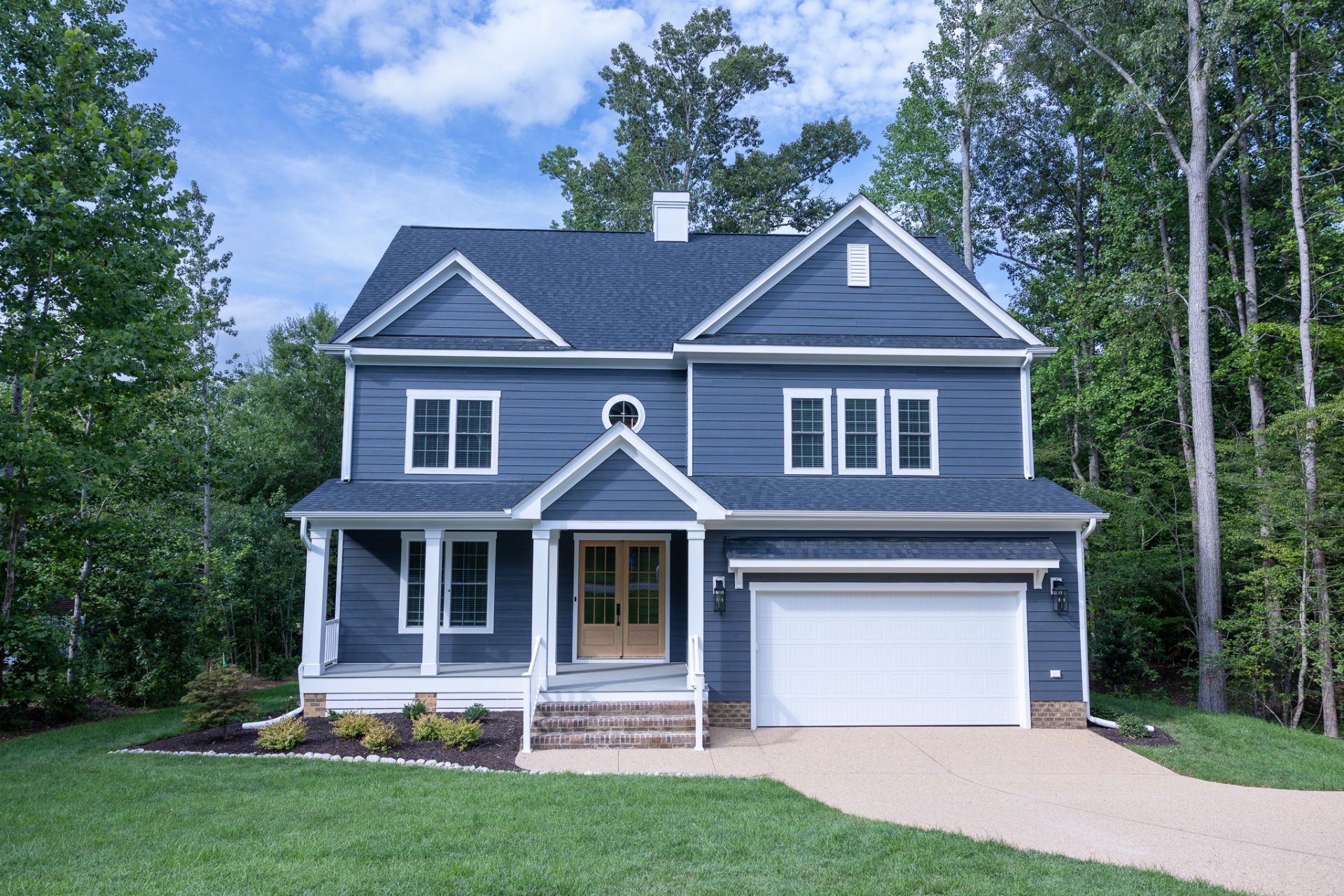 Turnberry — slate-blue two-story home with front porch